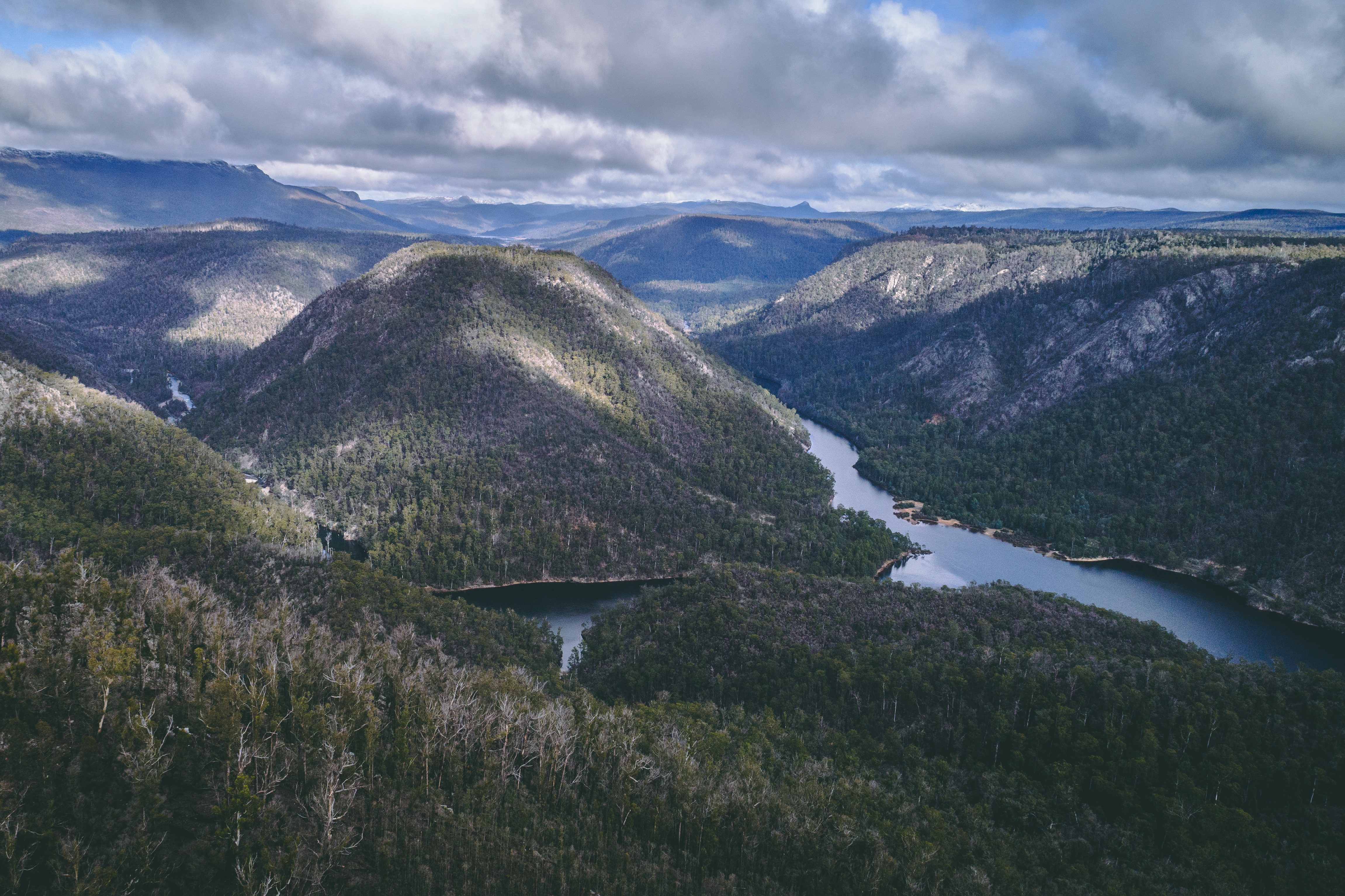 Mountainous terrain with a large river running through a valley