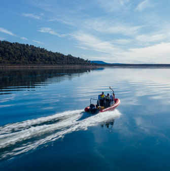 A boat with two hydro employees on Great Lake