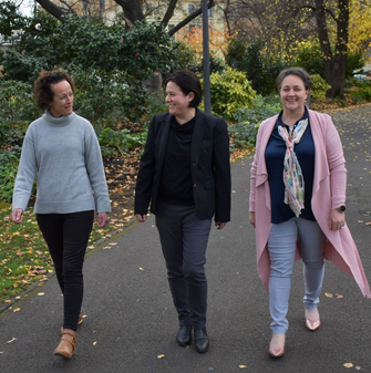 Three Hydro female leaders walking down a path